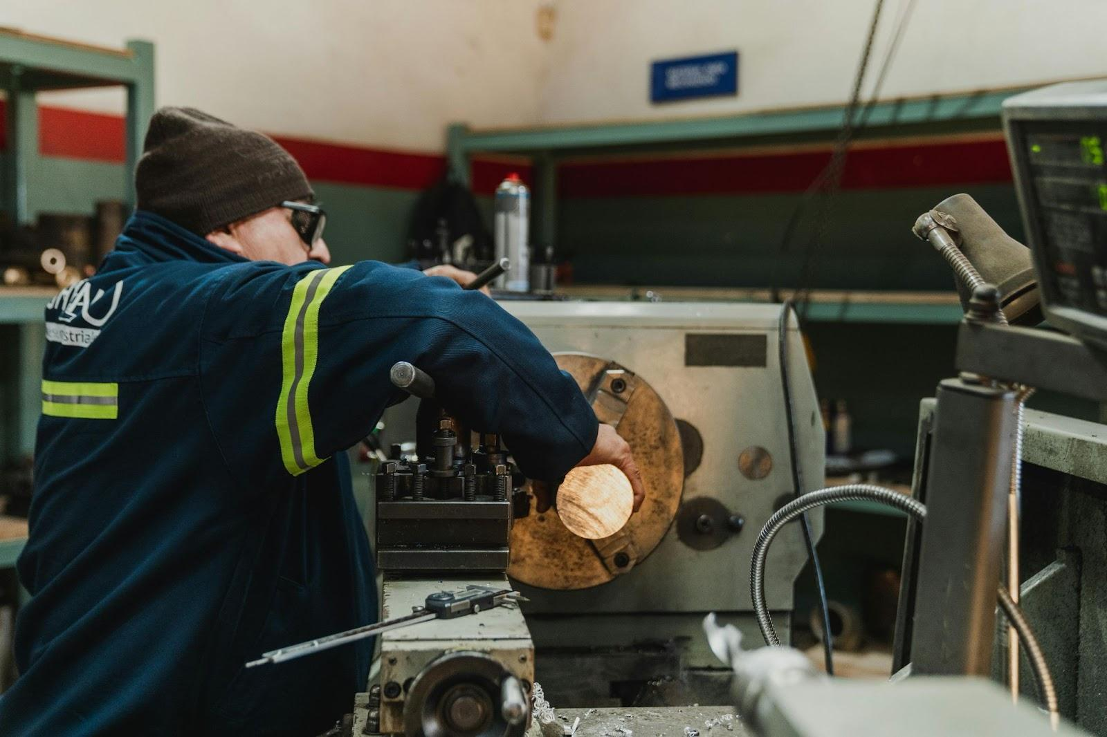 CNC Machinist Replacing Tool 