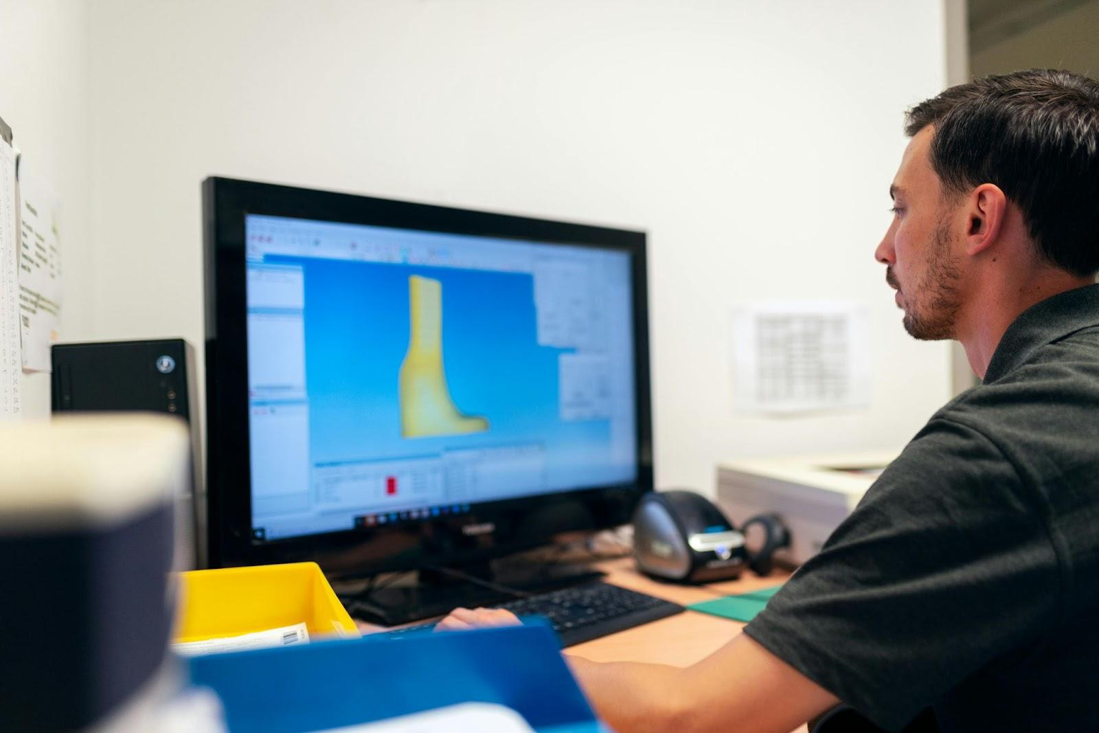 CNC Machinist Working on CAD